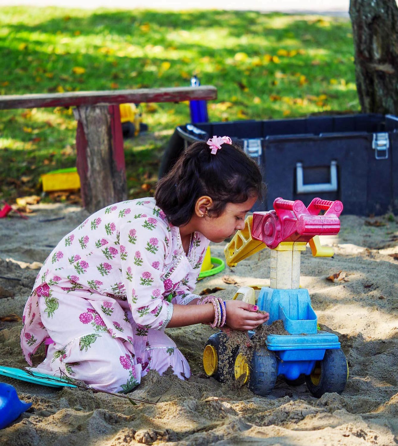 Child Playing with Toys in the Park